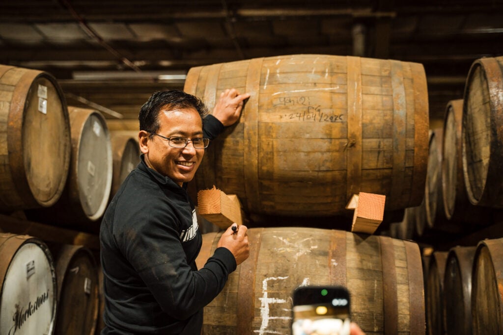 Hackstons client signing their whisky cask